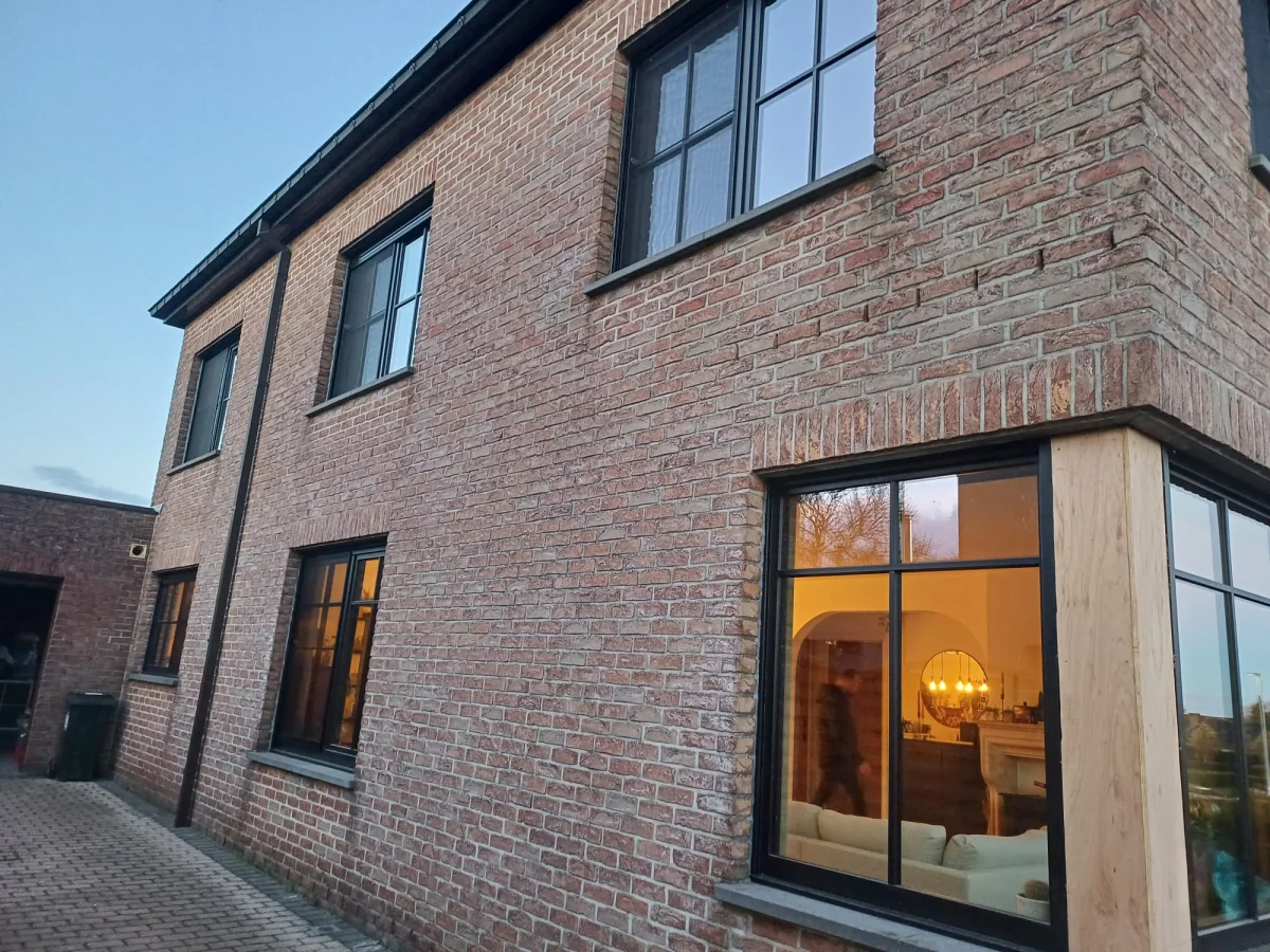Black windows with small wooden windows between the glass