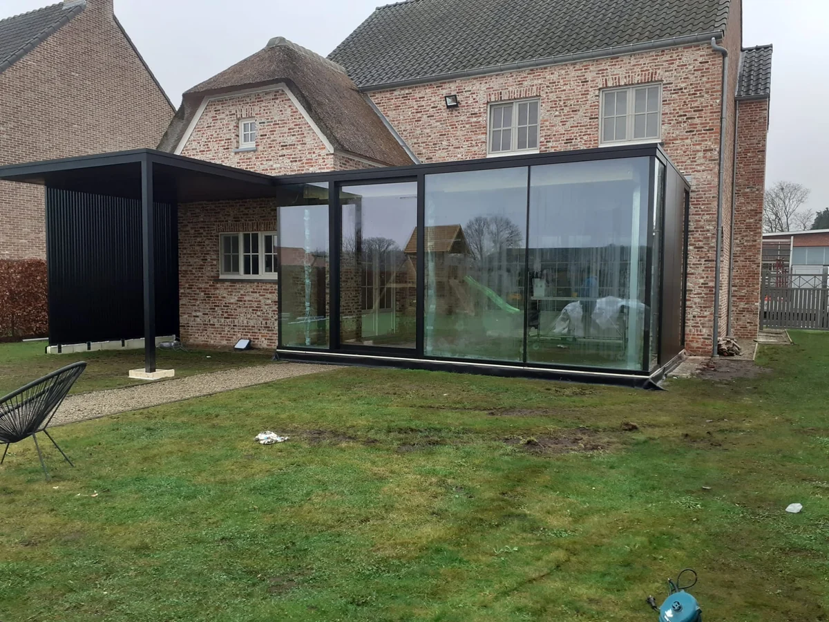 Aluminum canopy with glass walls on a home